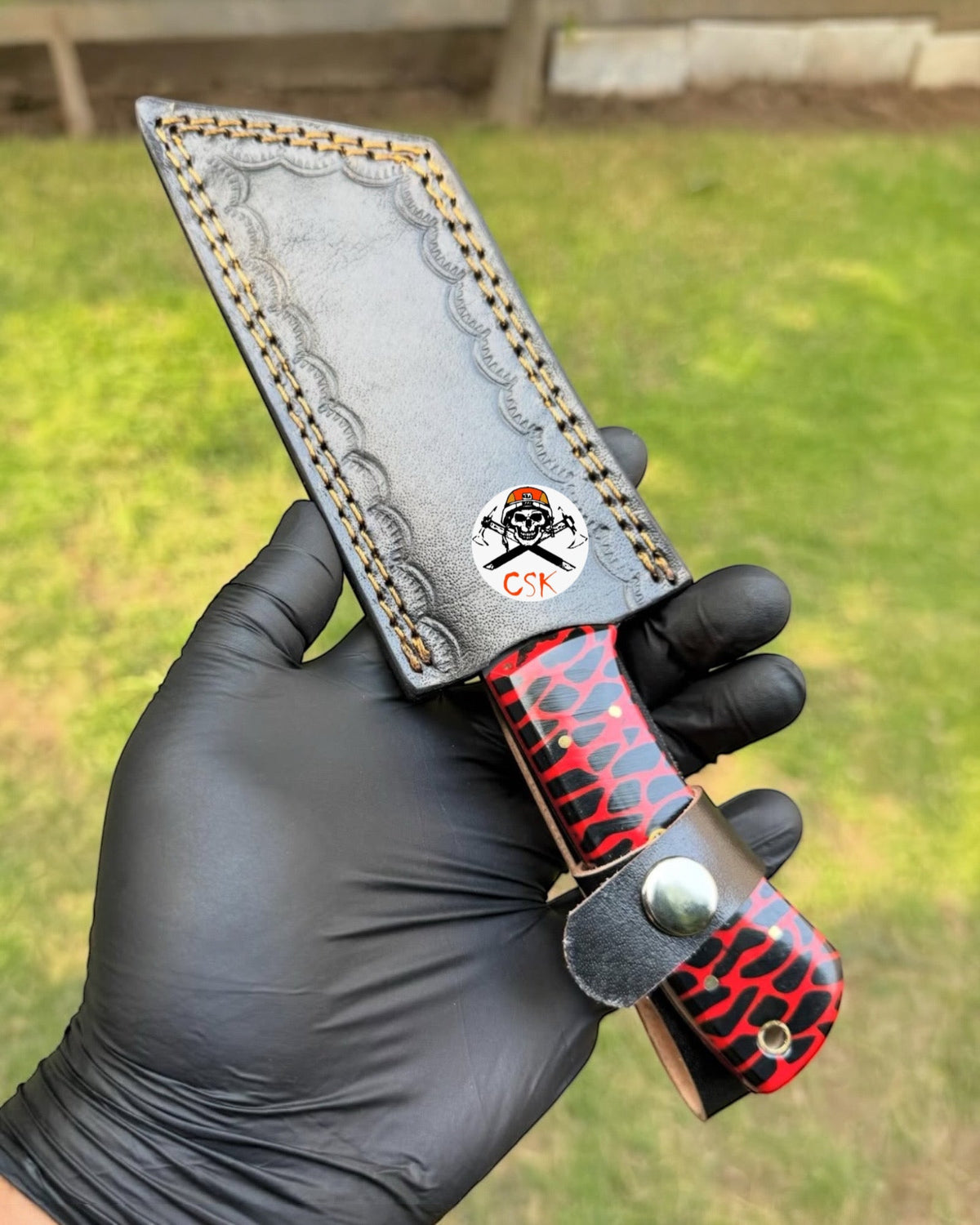 Red Viper Tanto hunting knife by cskforged with textured resin handle and satin blade, displayed on a neutral background.