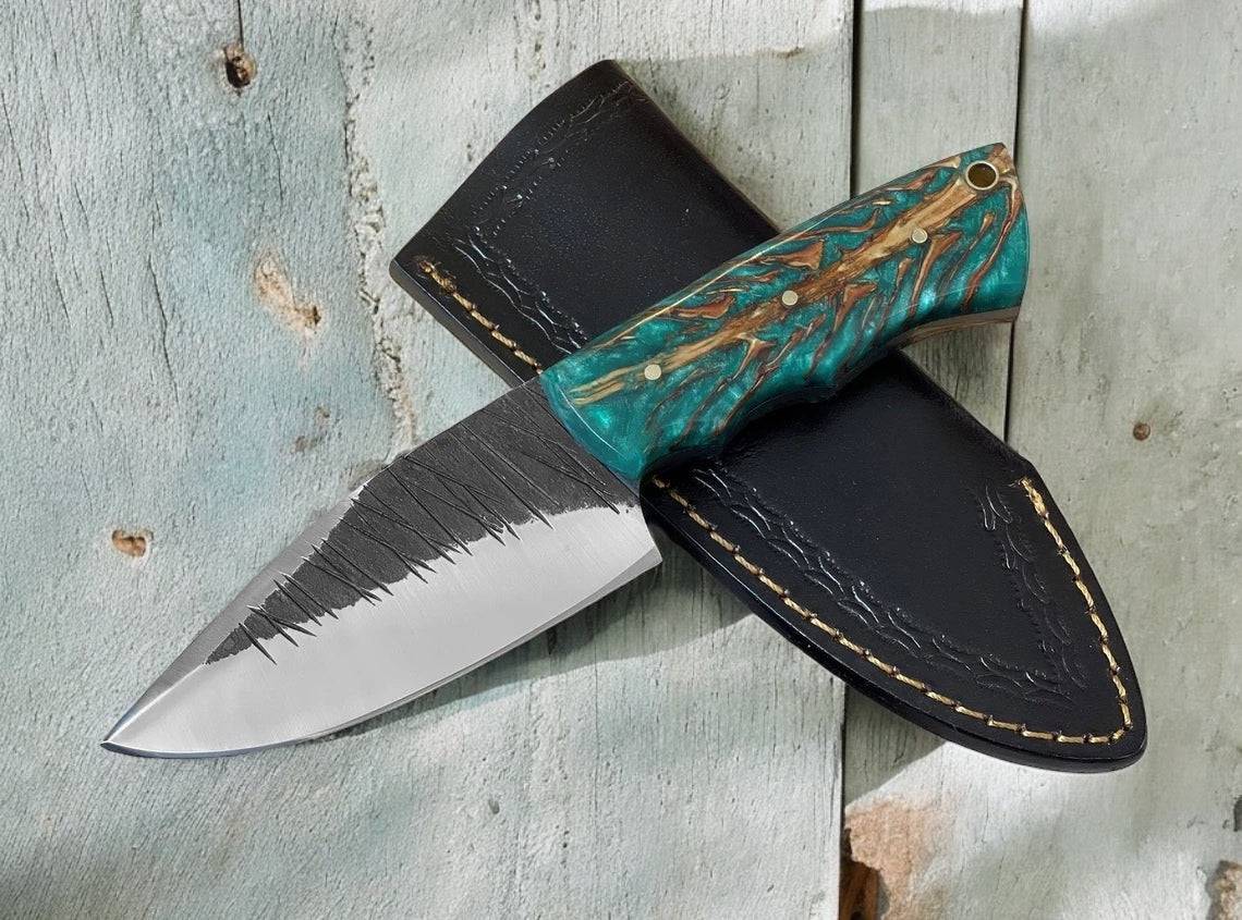 Handmade hunting knife with a pine cone handle and high carbon steel blade, fixed blade design by cskforged.