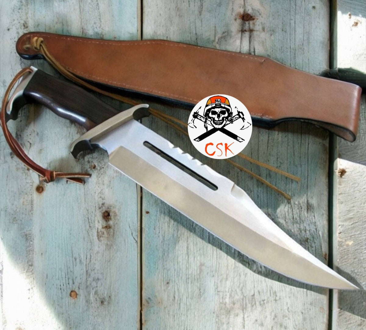 Close-up of cskforged Rambo Knife with D2 steel blade, featuring a rugged handle and sharp edge, ideal for survival and outdoor use.