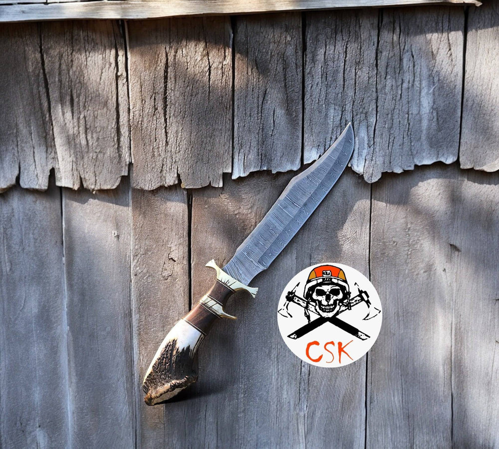 Large camping knife with 15-inch Damascus steel blade, rosewood handle, brass guard, and leather sheath by cskforged.