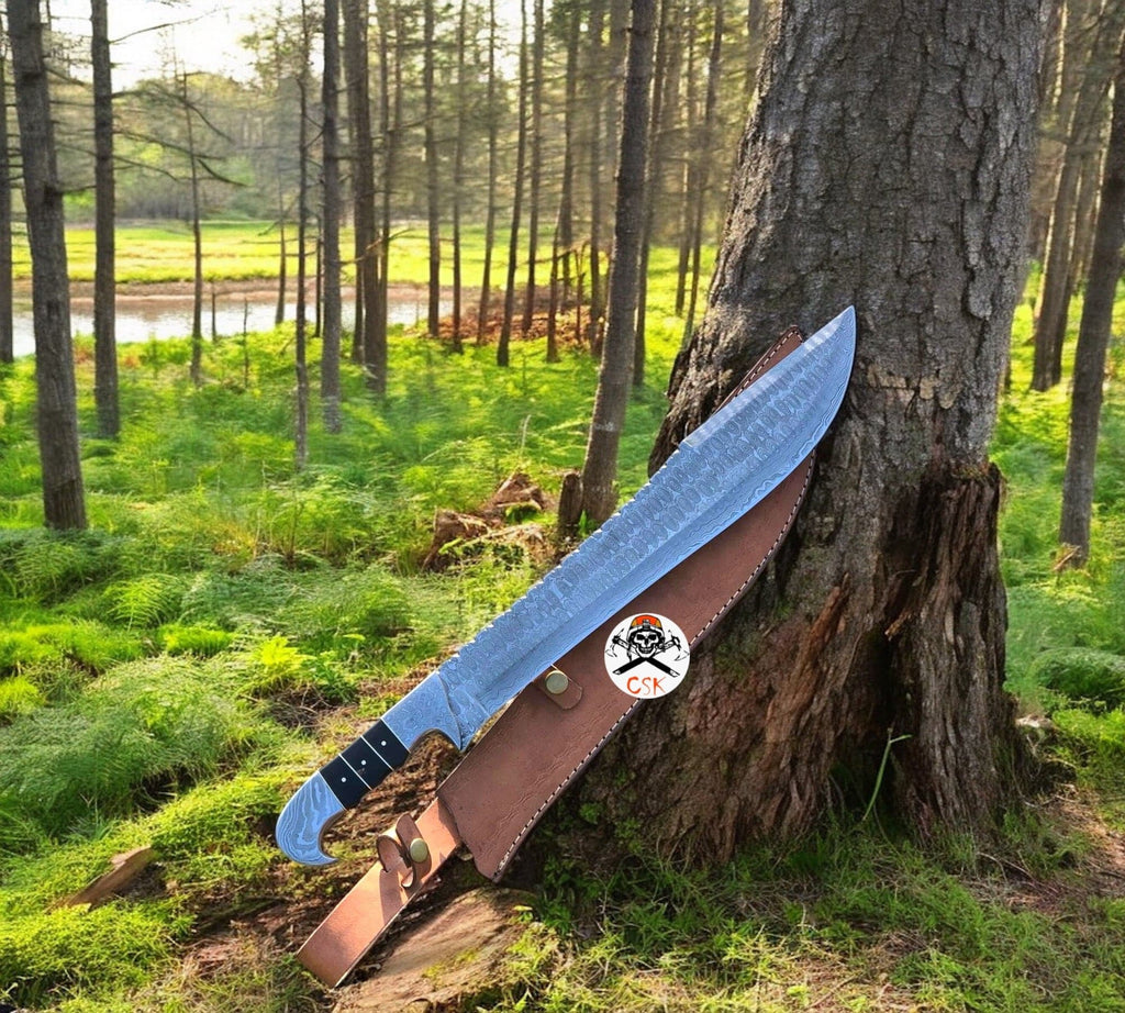 CSKforged full tang Damascus hunting and camping knife with resin and Damascus bolster handle, 17-inch blade, with leather sheath.