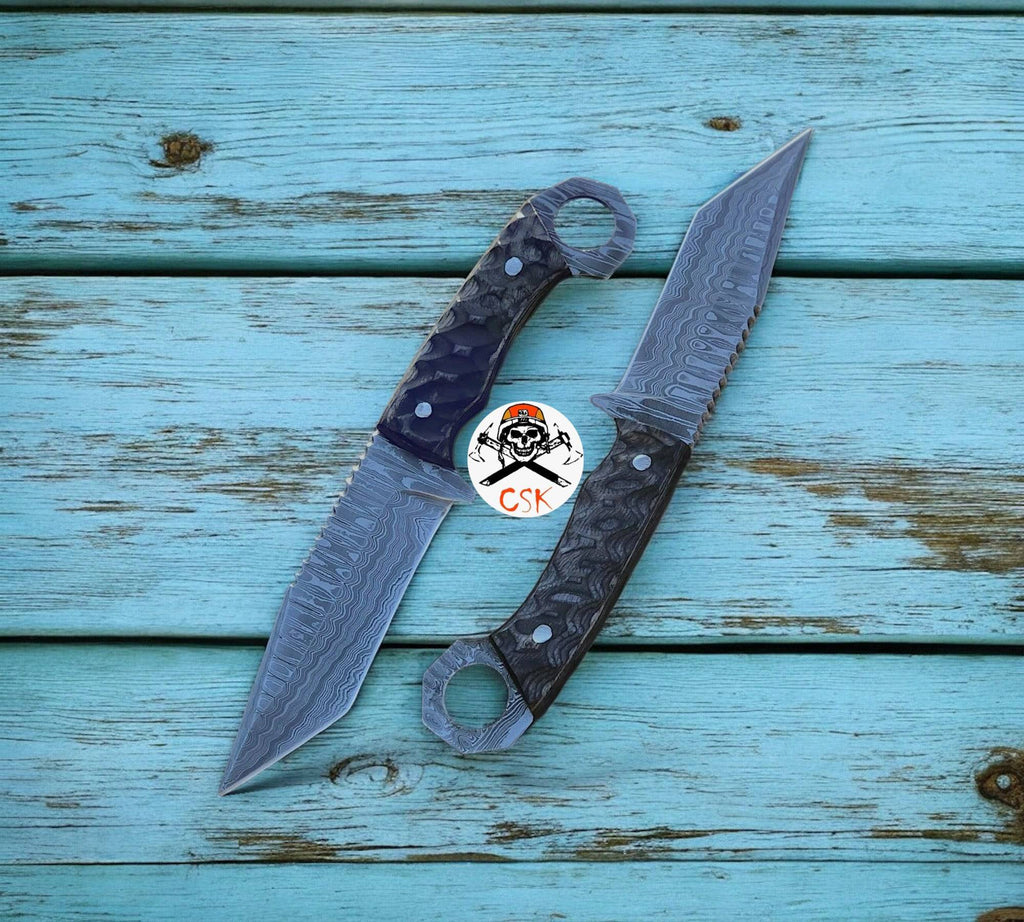 Damascus steel tanto blade hunting knife with ring-tail handle by cskforged, featuring a sharp blade and textured grip.
