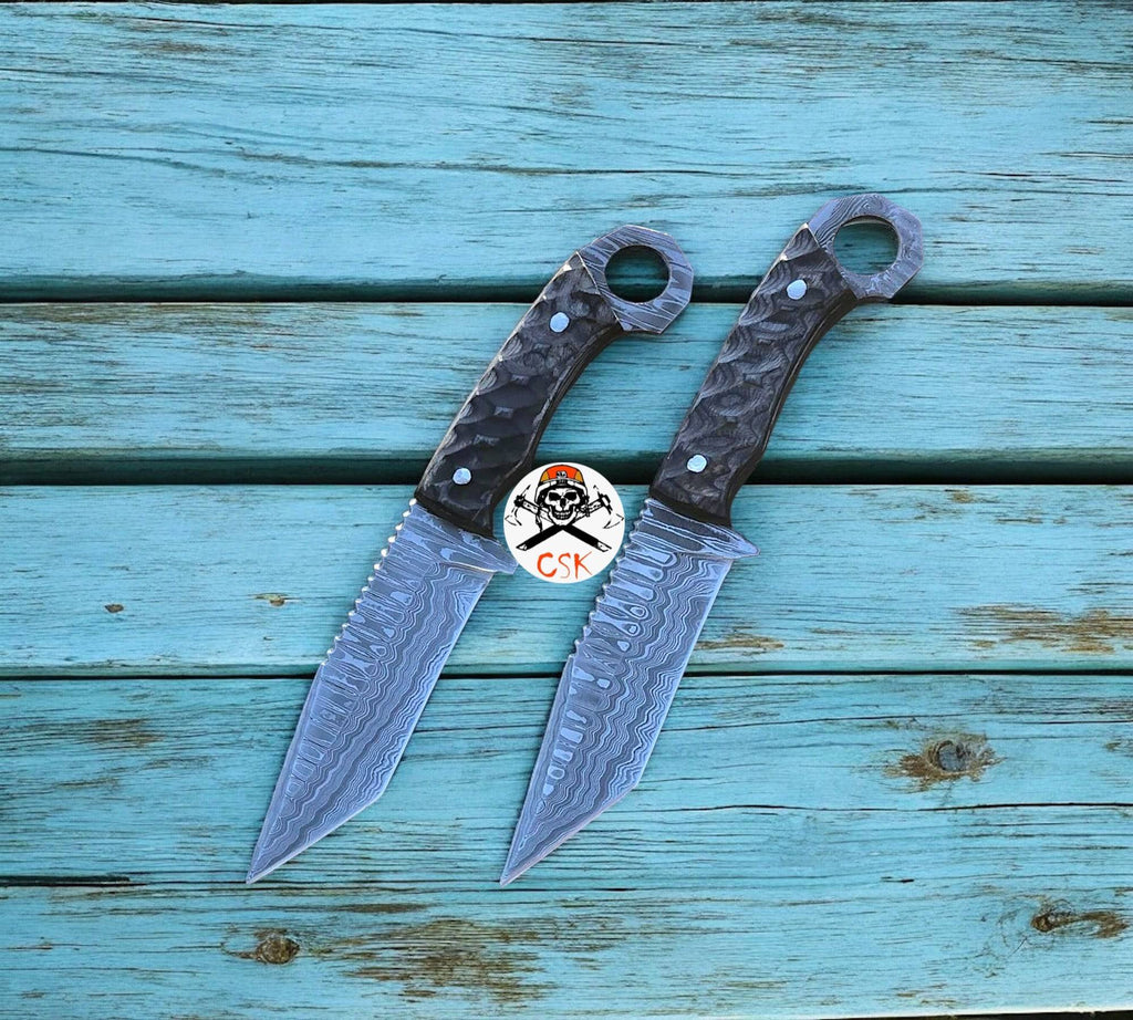 Damascus steel tanto blade hunting knife with ring-tail handle by cskforged, featuring intricate blade pattern and ergonomic handle.