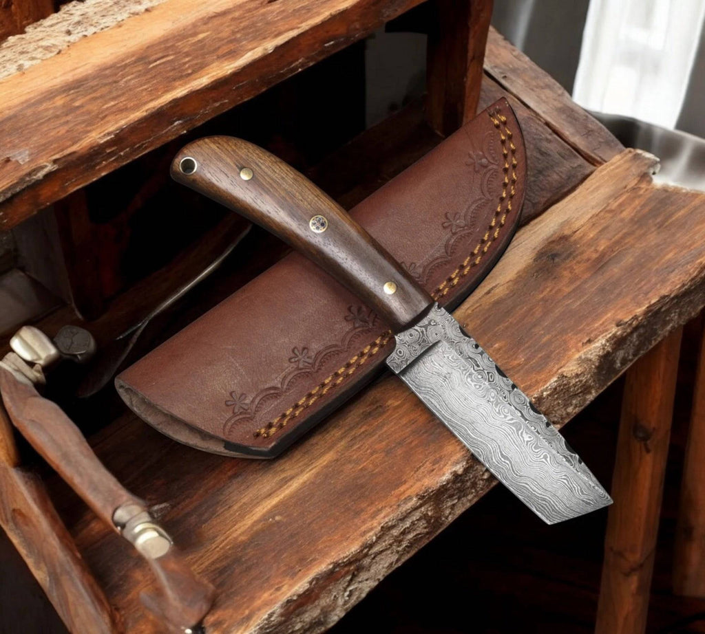 Fixed blade Tanto EDC knife by cskforged with leather sheath, featuring a sharp stainless steel blade and ergonomic handle.