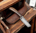 Fixed blade Tanto EDC knife by cskforged with leather sheath, featuring a sharp stainless steel blade and ergonomic handle.