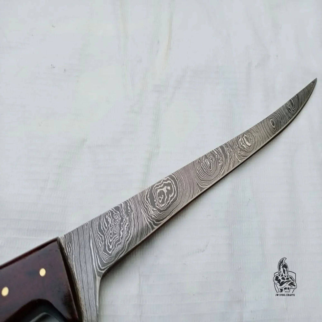 Handmade JW SteelCrafts fillet knife with a sleek blade and ergonomic handle, designed for precise fish filleting.