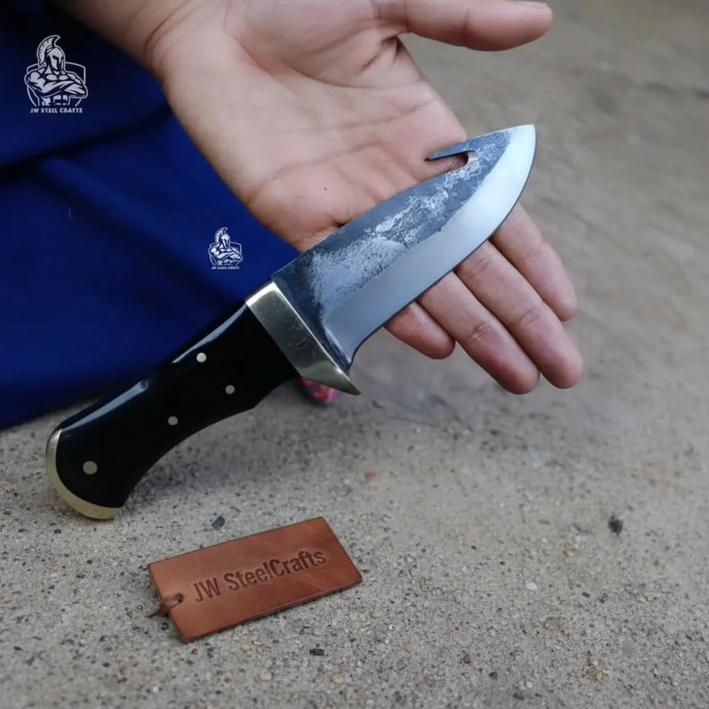 Gut hook knife with wood and brass handle