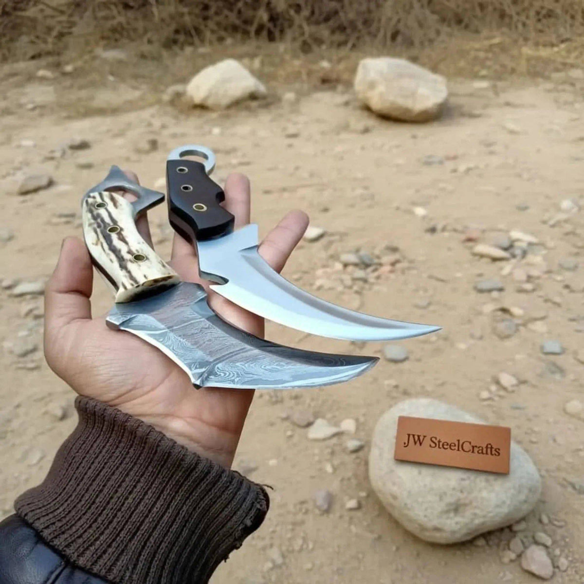 Damascus steel karambit knife pair with stag horn and wood handles, 9-inch blades, crafted by JW SteelCrafts.