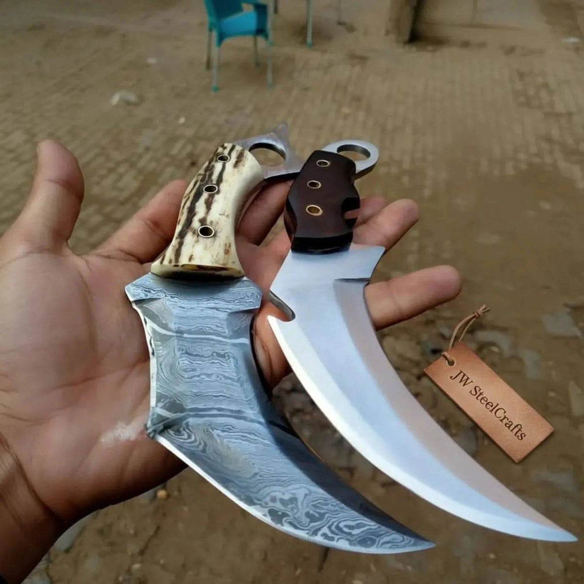 Damascus steel karambit knives with stag horn and wood handles, 9-inch blades, by JW SteelCrafts.