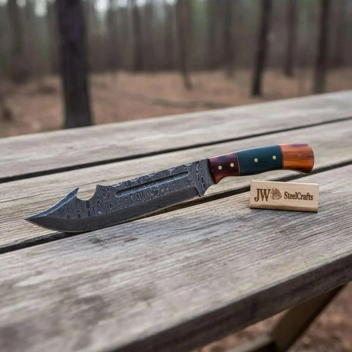 Damascus Harpoon Point Bowie Knife with colored bone coffin handle by JW SteelCrafts, showcasing intricate blade and handle details.