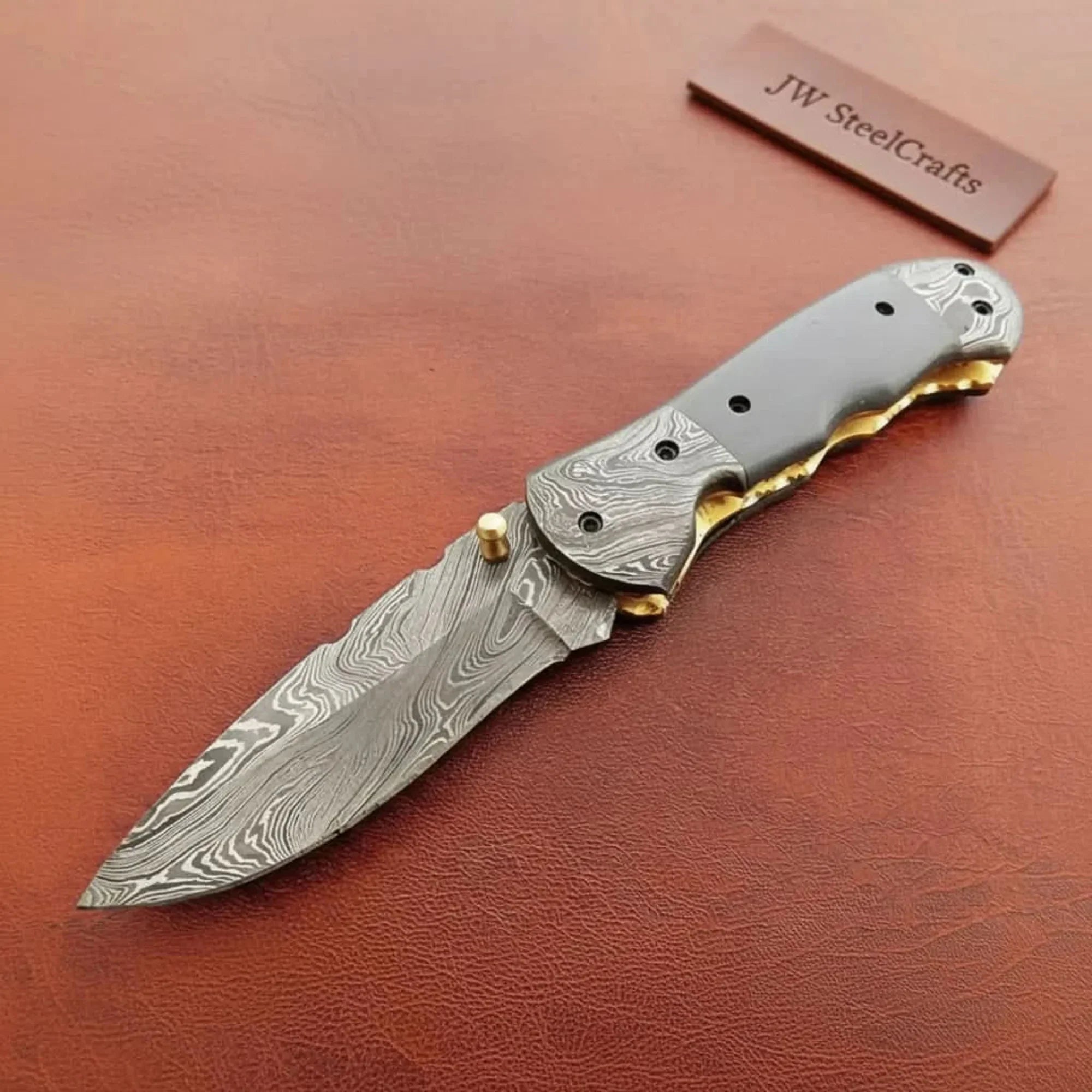 Damascus Black Horn Ridge Pocket Knife with Brass Bolster Accent