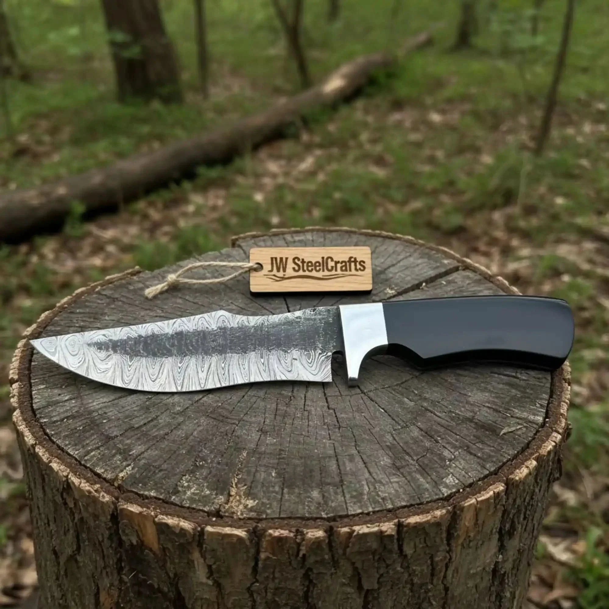Damascus Trailing Point Fixed Blade Hunting Knife — Forged Ladder Pattern Blade, Black Resin Handle & Steel Guard