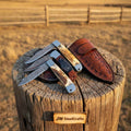 Handmade Damascus folding trapper knives set by JW SteelCrafts featuring stag horn and resin handle slipjoint knives.