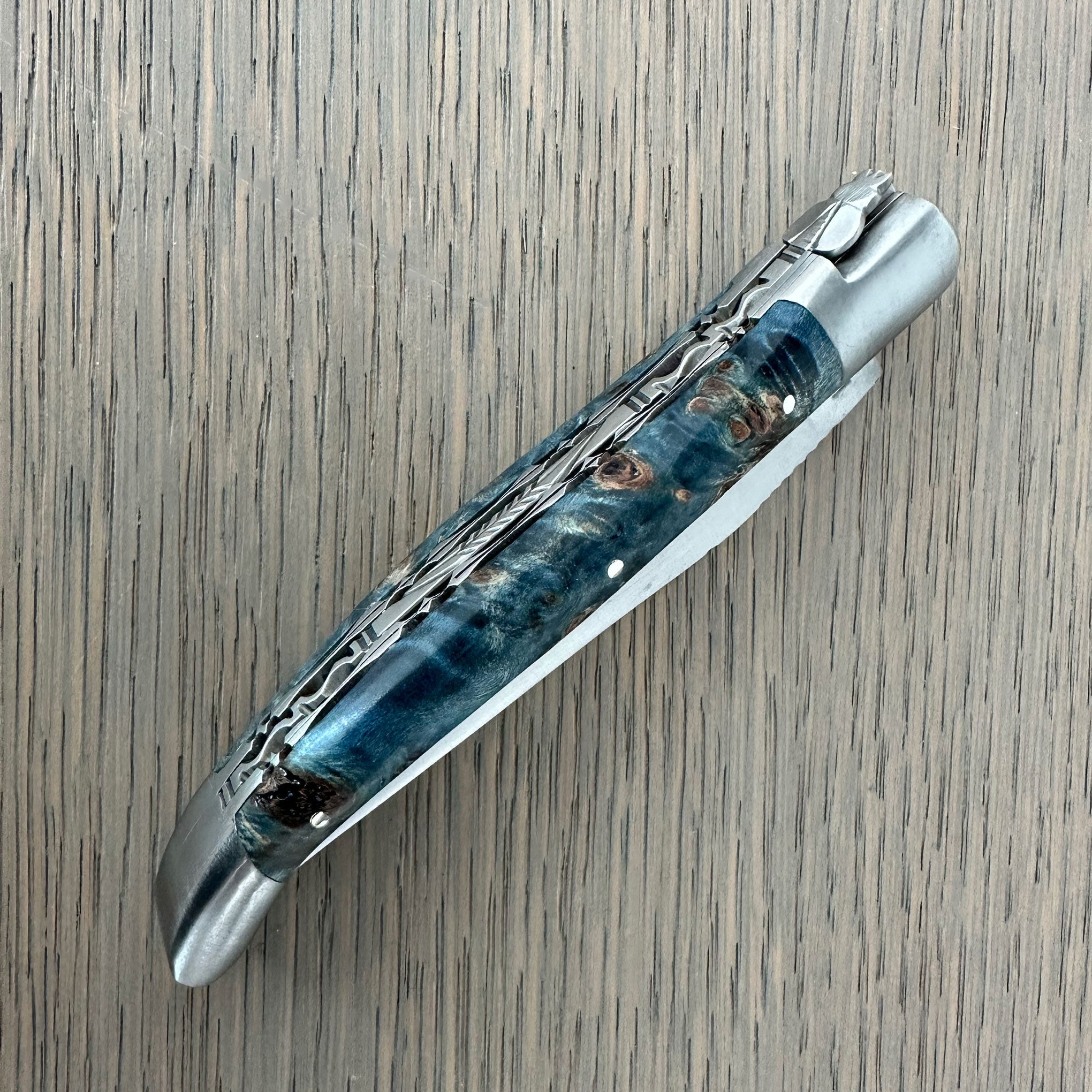Laguiole en Aubrac Folding Knife Double Plated Stabilized Blue Poplar Burl, 4.75-in