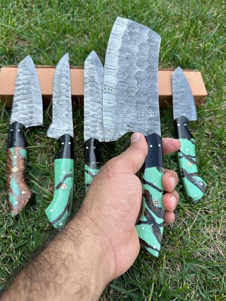 Professional chef slicing vegetables with a 13-inch Damascus steel kitchen knife from Knives Gear Garage's handmade knife set.