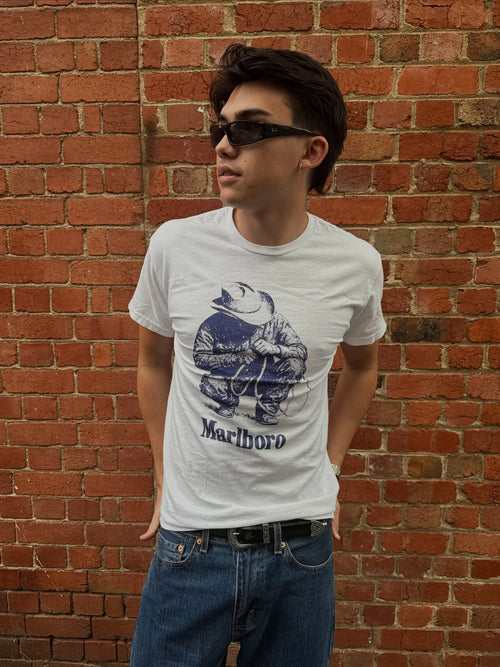 Vintage white 'Rustler' T-shirt by Parallel featuring a classic design, shown laid flat with visible neckline and short sleeves.