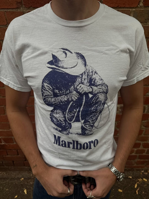 Classic white Vintage 'Rustler' T-shirt by Parallel featuring a relaxed fit and soft cotton fabric, displayed on a hanger.