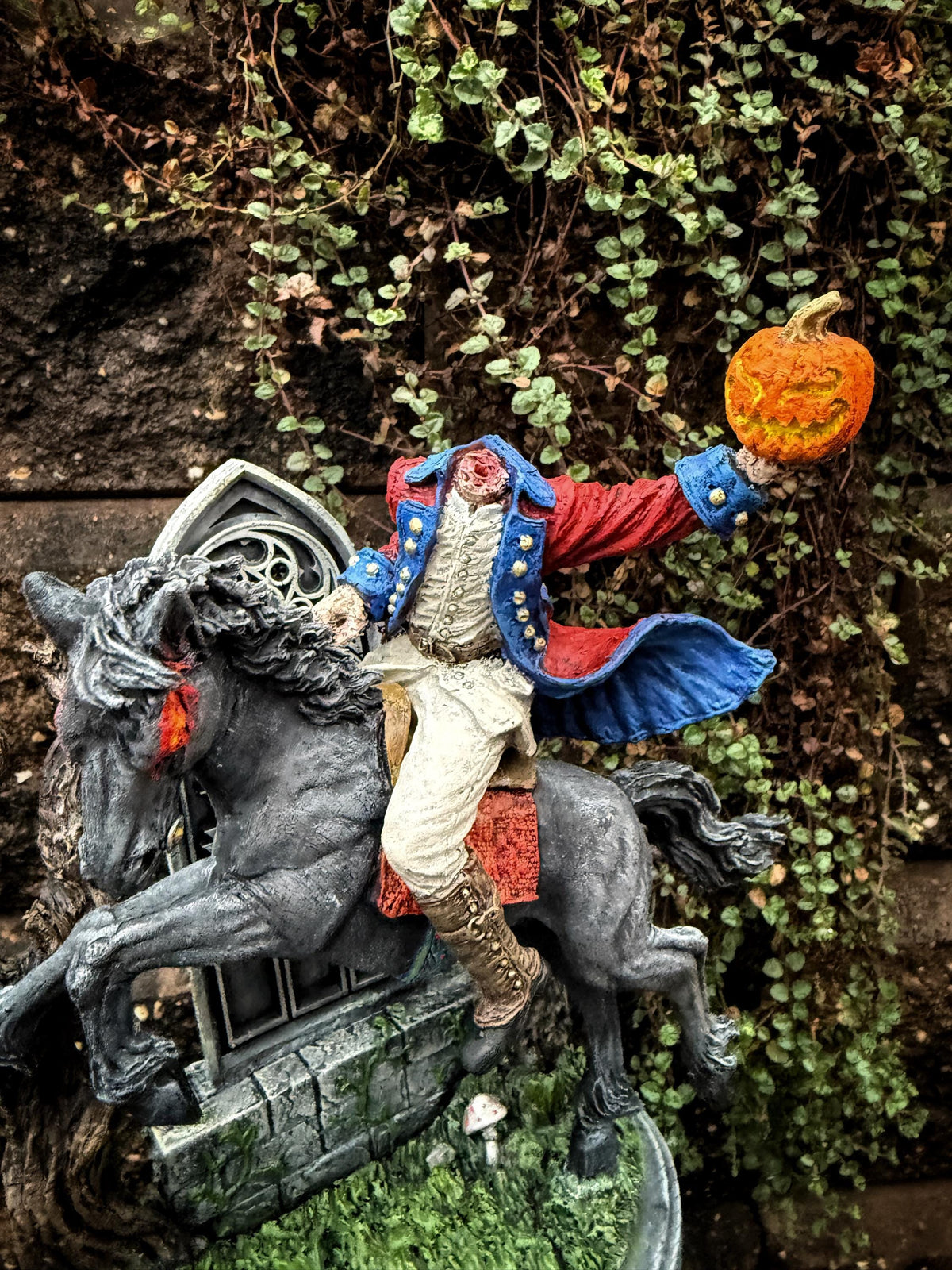 Full color resin Headless Horseman riding statue by Dellamorte & Co., Gothic Sleepy Hollow figurine for spooky Halloween decor.