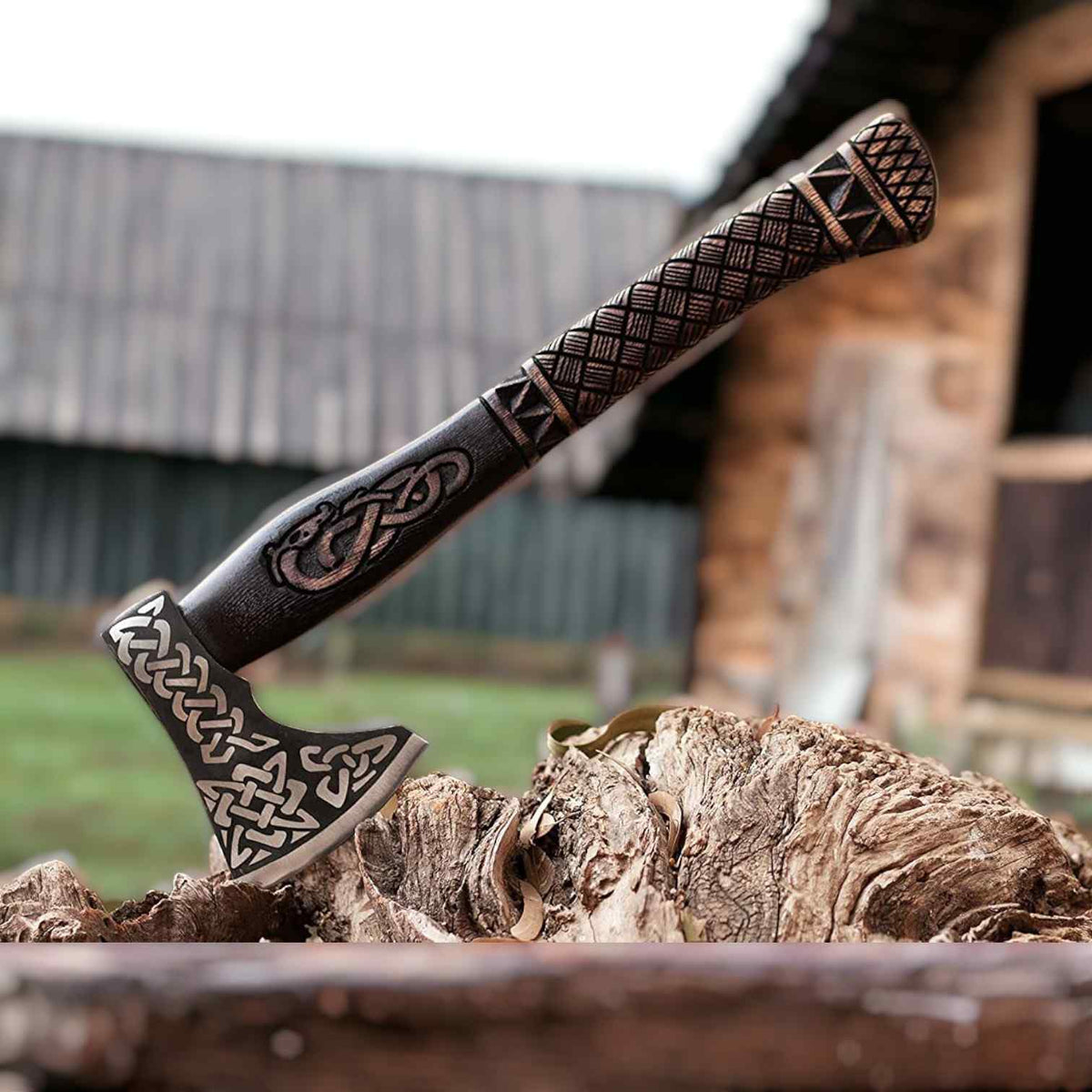 Hand-forged Viking axe with Celtic knotwork and carved dragon handle, featuring a bearded battle axe design by MALIKA KNIVES.