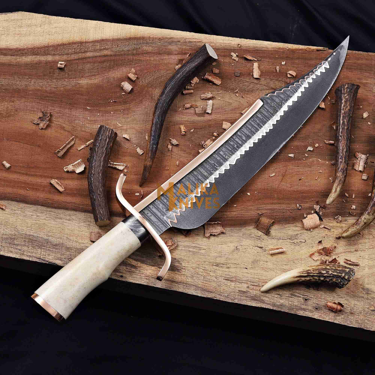 Copper Damascus Alamo Musso Bowie Knife by MALIKA KNIVES with a detailed patterned blade and a sturdy handle.