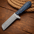 SHAM KNIVES cowboy knife with Damascus steel blade, bullcutter design, and pancake sheath for outdoor and camping use.