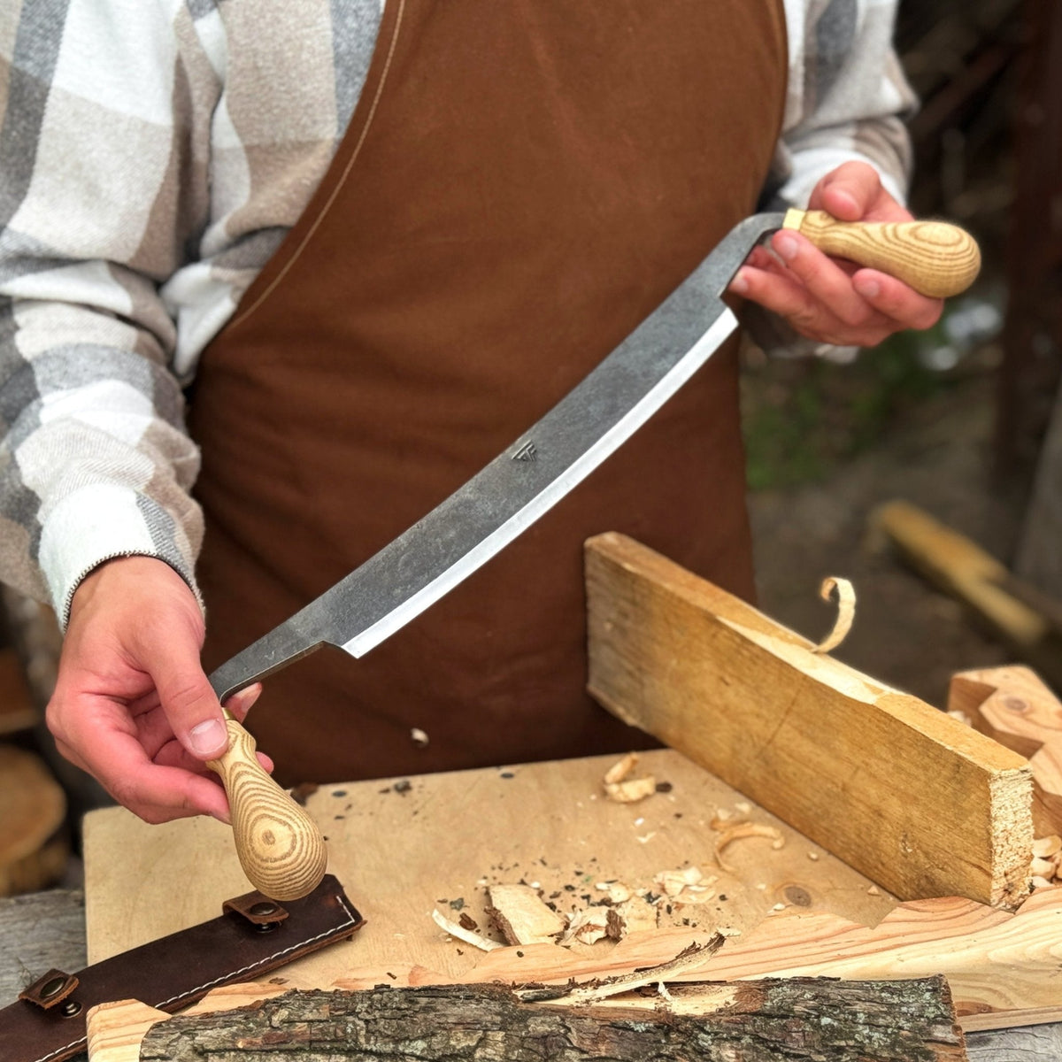 Sharky Forged Steel Tools curved draw knife with 25.5 cm (10 inch) cutting edge, ideal for shaping and shaving wood.