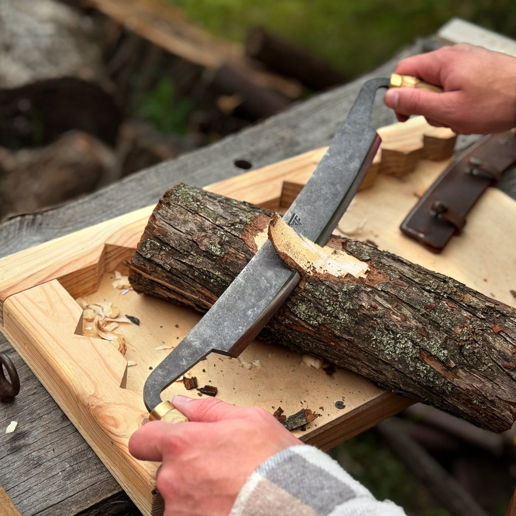 Sharky Forged Steel Tools curved draw knife with a 25.5 cm (10 inch) cutting edge, designed for carving and shaving wood.