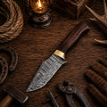Custom handmade Damascus steel fixed blade hunting and survival knife by SHAM KNIVES, featuring a detailed Damascus steel blade and sturdy handle.
