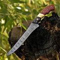 Damascus fish fillet knife by Malika Knives with red honeycomb and camel bone handle, showcasing a sharp blade for precise filleting.