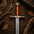 Close-up of the Ember Sigil Damascus Steel Viking Sword handle by CSK Forged, showing intricate craftsmanship and detailed design.