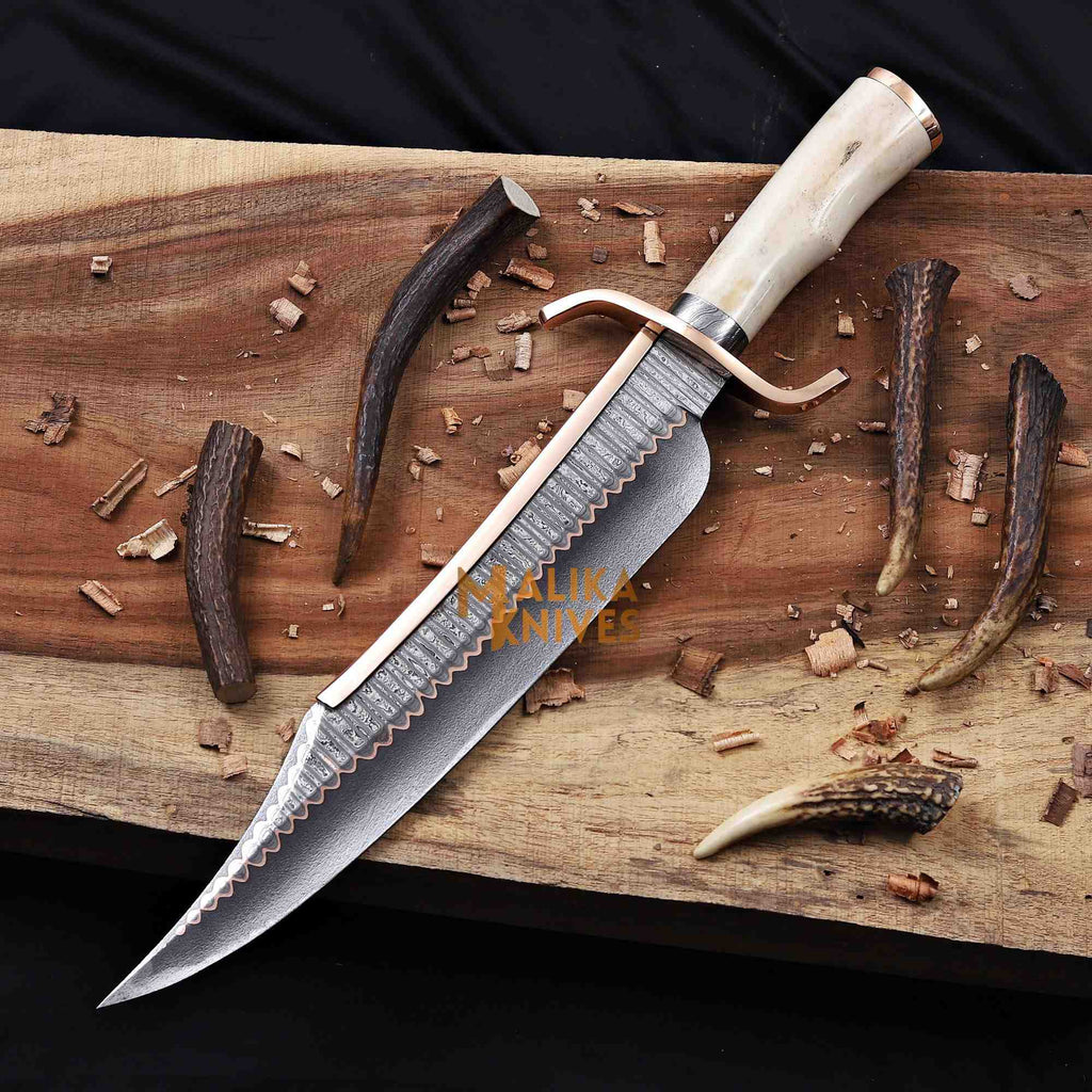 Full view of MALIKA KNIVES Copper Damascus Alamo Musso Bowie Knife with camel bone handle and full tang construction.