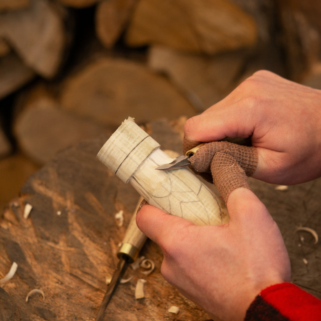 Hand-carving a wooden Freyja figurine with a specialized tool - Sharky Forged Steel Tools