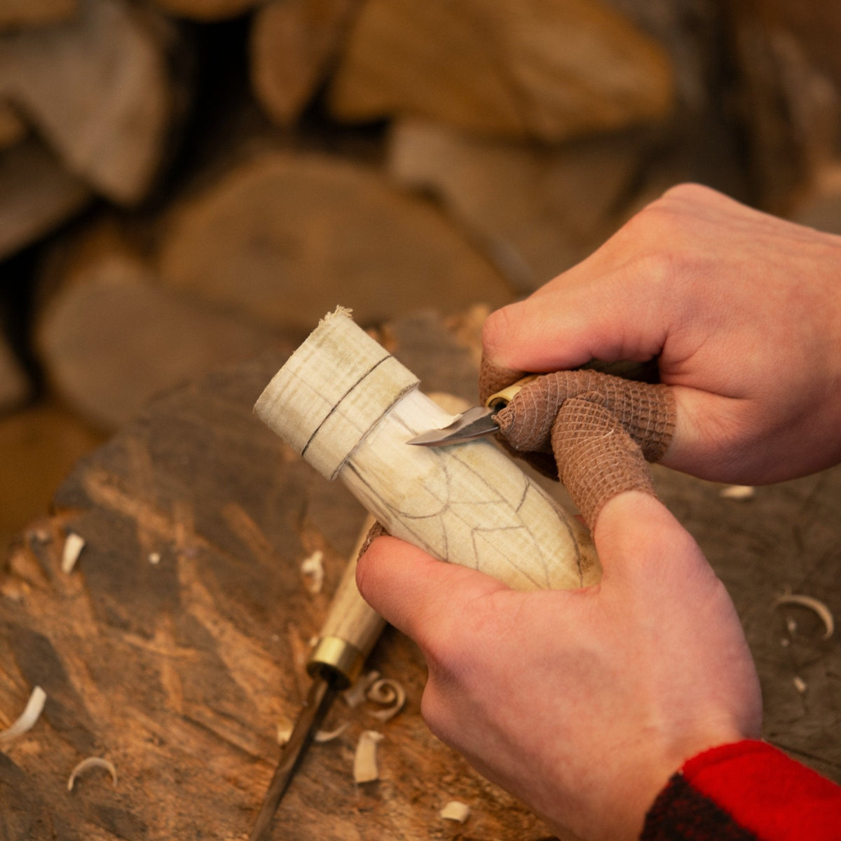 Hand-carving a wooden Freyja figurine with a specialized tool - Sharky Forged Steel Tools