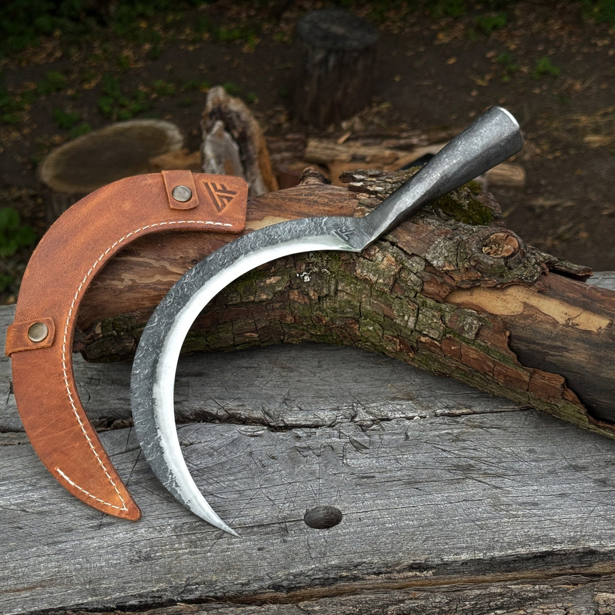 Hand-forged large sickle by Sharky Forged Steel Tools with a 19 cm (7.5-inch) blade, featuring a curved metal blade and wooden handle.