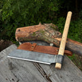 Hand-forged Sharky Steel splitting froe blade, 25.5 cm (10 inches), with a sturdy wooden handle for splitting wood.
