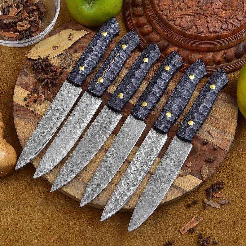 Handmade CSK Forged steak knives set with Damascus steel blades and Pakka wood handles, ideal for precise slicing and elegant dining.