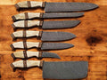 Handmade Damascus kitchen knives set with bone and rosewood handles, featuring sharp blades and intricate Damascus pattern.