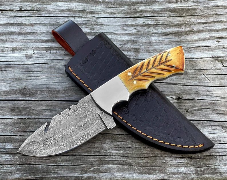 Handmade SHAM KNIVES hunting knife with Damascus steel fixed blade and carved burnt camel bone handle.