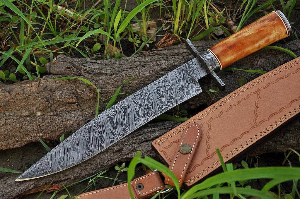 Custom handmade Damascus steel hunting Bowie knife with bone handle, 15-inch blade, Damascus guard, and leather sheath.