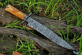 Custom handmade Damascus steel hunting Bowie knife with bone handle, 15-inch blade, Damascus guard, and leather sheath.