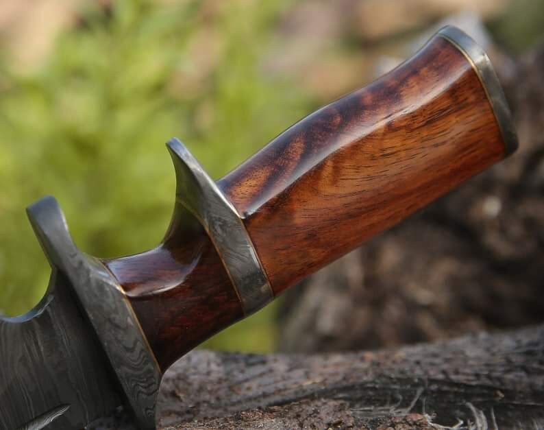 Custom handmade Damascus Steel Bowie Knife with 13-inch blade, rosewood handle, steel guard, and leather sheath.