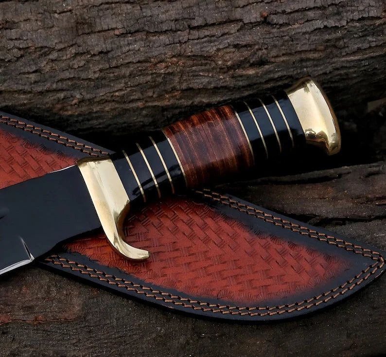 Custom handmade J2 steel coated crocodile Bowie knife with leather handle, brass guard, and leather sheath by Knives Gear Garage