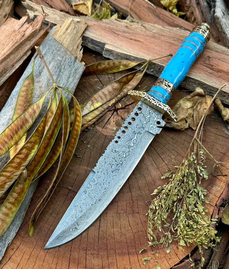 Custom handmade Damascus steel Bowie knife with leather handle, brass guard, resin inlay, and leather sheath by Knives Gear Garage