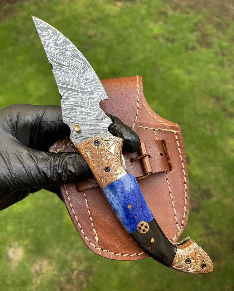 Damascus Blade EDC folding pocket knife by cskforged with a patterned Damascus steel blade and a sleek handle.