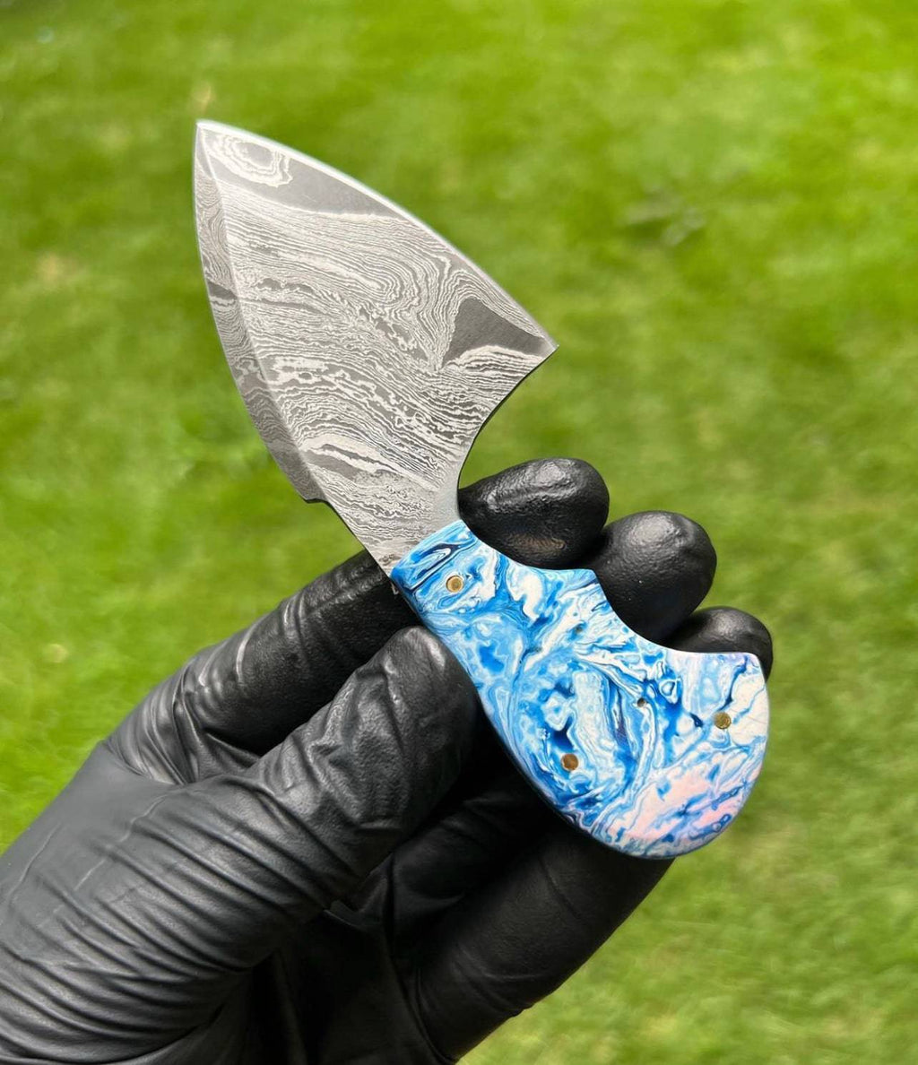 Fixed blade custom handmade Damascus steel skinning knife by cskforged, featuring a textured handle and sharp, durable blade.