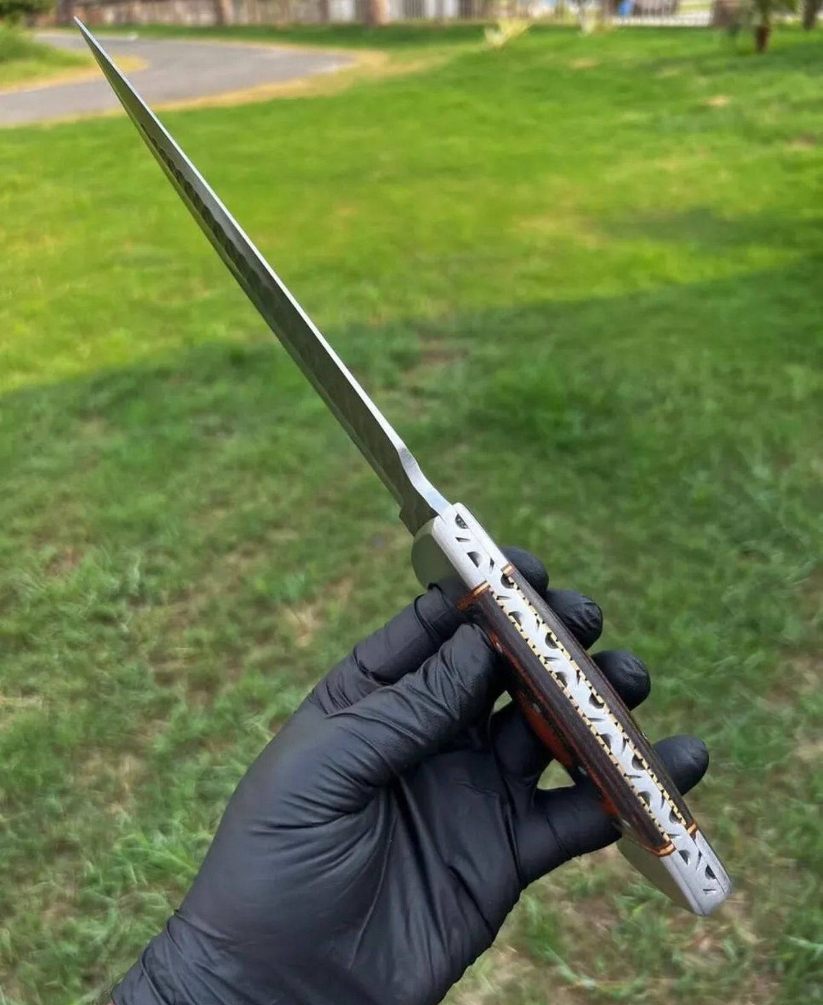Fixed blade camping knife with hand-forged D2 steel blade and black handle by cskforged, ideal for outdoor survival and camping.