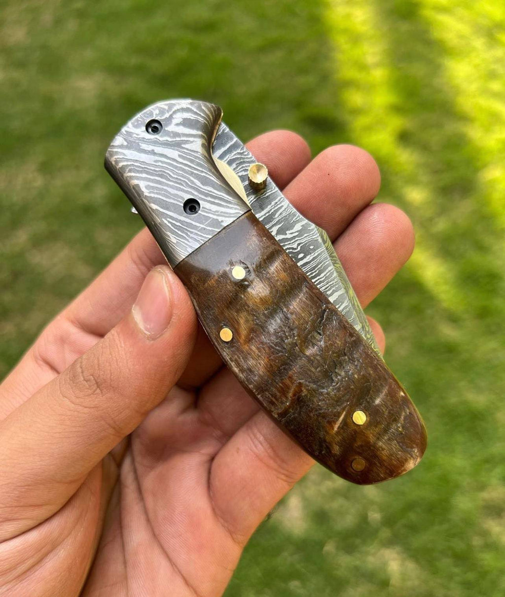 Custom handmade Damascus steel Tanto blade EDC folding pocket knife by cskforged, featuring a sharp blade and ergonomic handle.