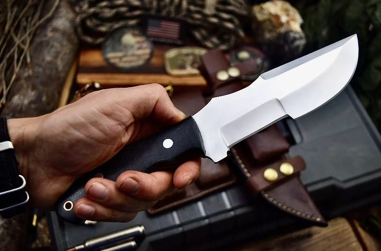 Custom handmade D2 steel tracker knife by Knives Gear Garage, featuring a textured handle and sharp blade for outdoor use