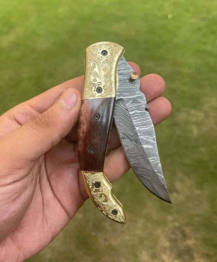 Damascus Blade EDC pocket knife by cskforged, featuring a patterned steel blade and ergonomic handle for everyday carry.