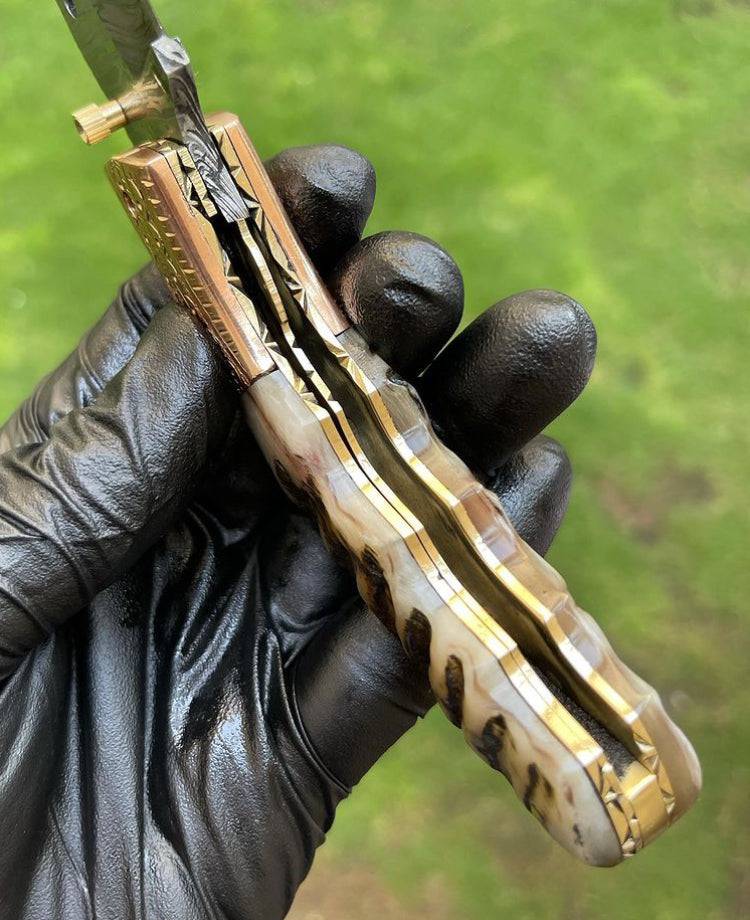 Damascus folding pocket knife by cskforged with a sleek, closed blade design and textured handle, ideal for everyday carry.